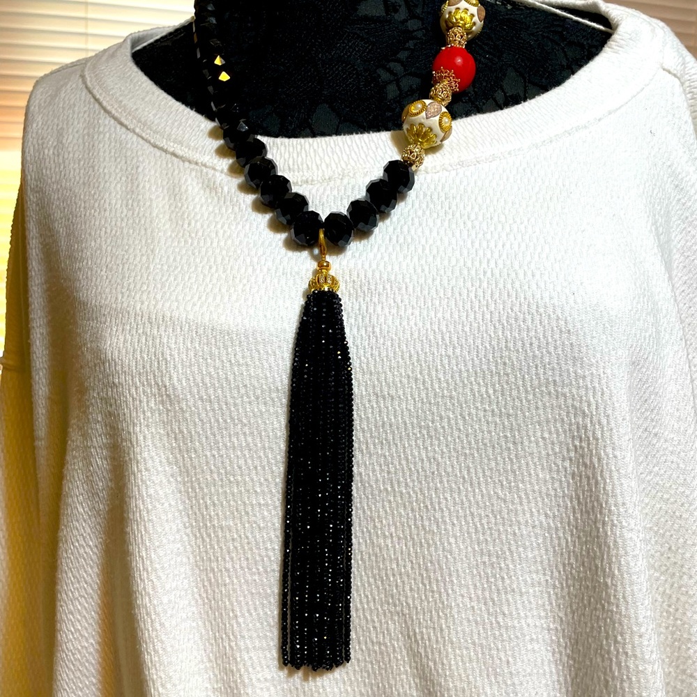 Handmade black bead necklace with cloisonné inspired accent.